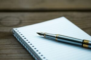 Notebook and pen ready for comparing SEO company pricing