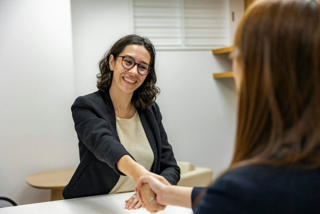 Hiring manager shaking hands with an SEO expert candidate