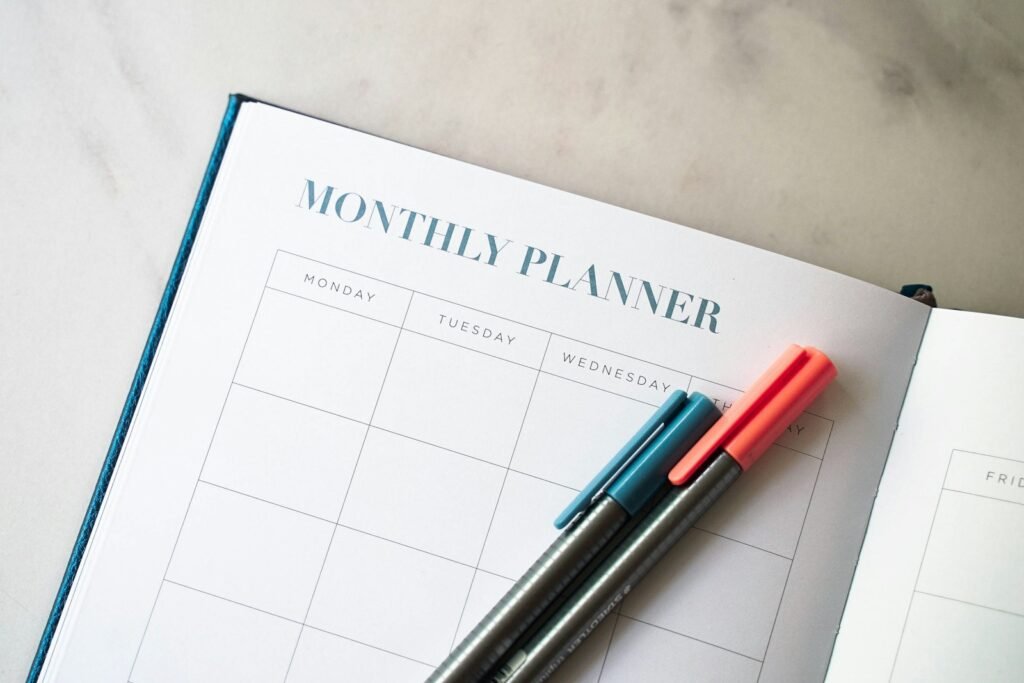 Monthly planner with pens, representing monthly SEO packages