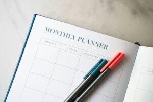 Monthly planner with pens, representing monthly SEO packages