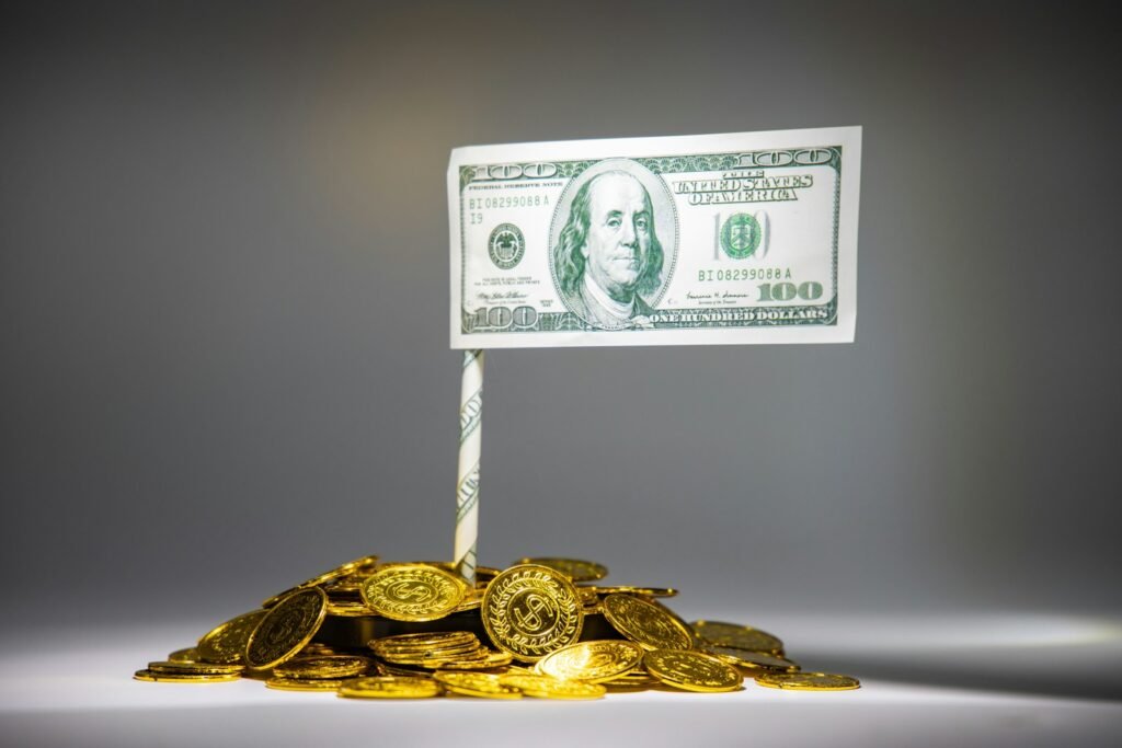 Banknote on a pile of coins, representing SEO pricing expectations
