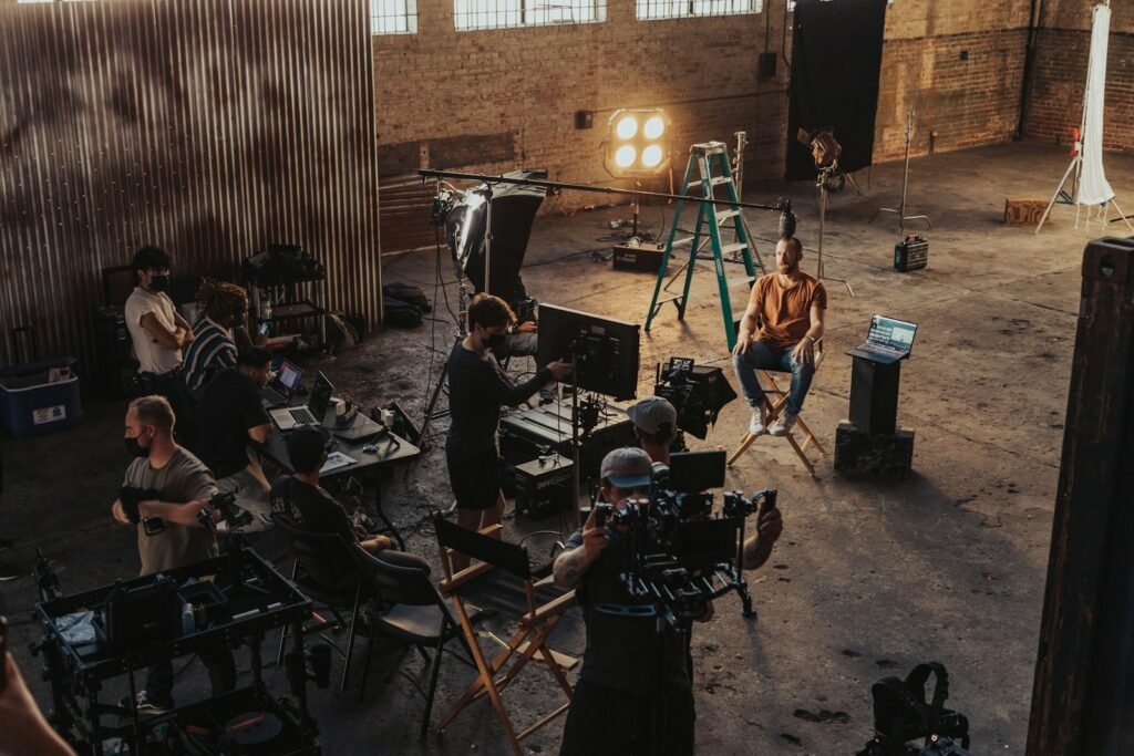 Video production crew working on a film set in a studio