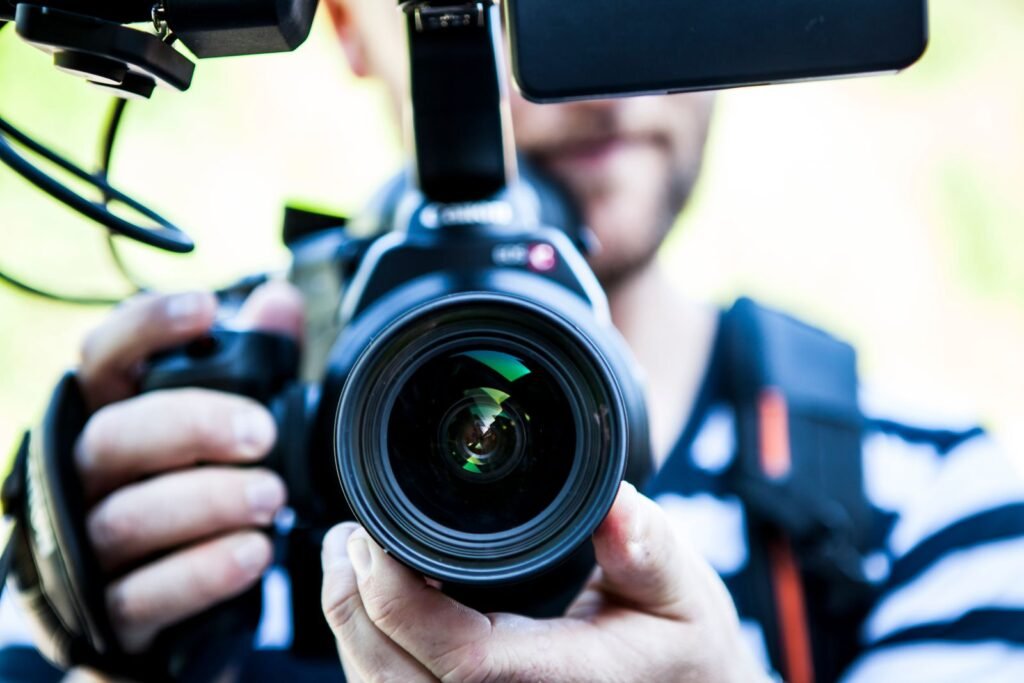 A camera operator filming on set during a videography shoot for advertising in Singapore.