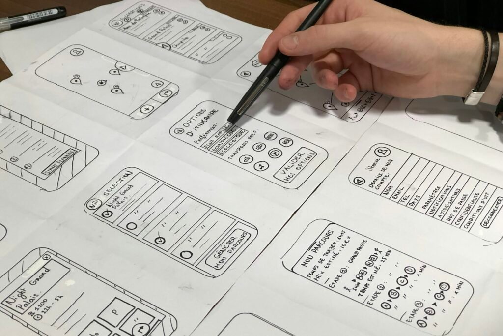 Designer sketching website wireframes for a website revamp
