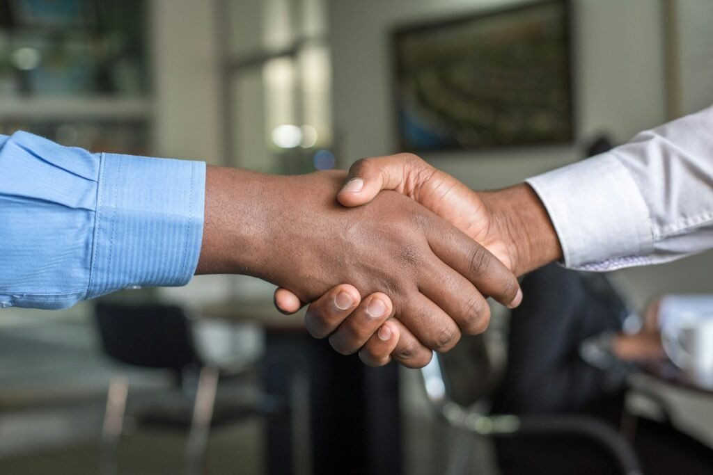 Handshake between business partners, representing working with an SEM agency