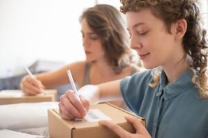 Singapore ecommerce seller reviews order costs beside packed parcels and a margin spreadsheet.