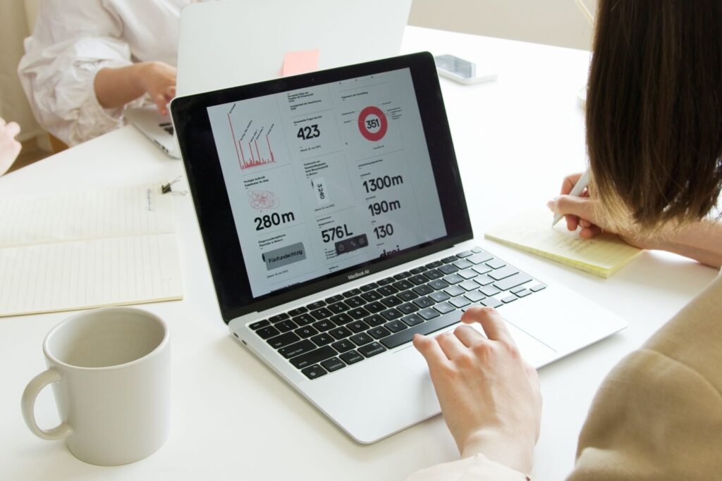 Singapore SME marketing manager reviewing website traffic and enquiry performance on a laptop.